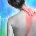 Woman with pain in her back and neck